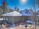 House exterior with double garage and snowy yard at 25060 Montane Drive West, Golden, CO 80401