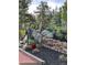 Landscaped rock wall with various plants at 25060 Montane Drive West, Golden, CO 80401