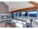 Living room with expansive windows and mountain views at 25060 Montane Drive West, Golden, CO 80401