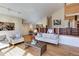 Bright living room featuring hardwood floors and comfy seating at 25060 Montane Drive West, Golden, CO 80401