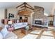 Spacious living room with stone fireplace and hardwood floors at 25060 Montane Drive West, Golden, CO 80401