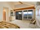 Main bedroom with mountain views, balcony access and modern furniture at 25060 Montane Drive West, Golden, CO 80401