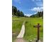 Wooden boardwalk trail in a grassy field at 25060 Montane Drive West, Golden, CO 80401