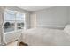 Cozy bedroom with large window, curtains, and neutral carpet at 24285 E Wagon Trail Ave, Aurora, CO 80016