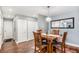 Cozy dining area with hardwood floors, wood table set, and ample closet space at 9315 E Center Ave # 3D, Denver, CO 80247