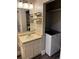 Vanity sink and washing machine at 1222 Yosemite St, Denver, CO 80220