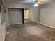 View of a carpeted bedroom with ceiling fan and mirrored closet at 1222 Yosemite St, Denver, CO 80220