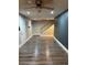 View of a large living room with wood floors and stairs leading to the second floor at 1222 Yosemite St, Denver, CO 80220