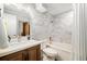 Modern bathroom features marble-patterned tile, a soaking tub, and a wooden vanity for a luxurious feel at 6305 W 6Th Ave # C12, Lakewood, CO 80214