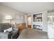 Comfortable bedroom featuring a cozy armchair, dresser, and a closet with built-in storage solutions at 6305 W 6Th Ave # C12, Lakewood, CO 80214