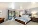 Cozy bedroom with outdoor access, soft carpet, and neutral decor, offering a serene and peaceful atmosphere at 6305 W 6Th Ave # C12, Lakewood, CO 80214