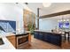 Bright kitchen featuring an indoor courtyard with a wooden accent wall and modern appliances at 6305 W 6Th Ave # C12, Lakewood, CO 80214