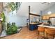 Open kitchen featuring an indoor courtyard with a tree and a view of the dining area at 6305 W 6Th Ave # C12, Lakewood, CO 80214