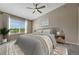 Comfortable bedroom with large window, neutral colors, and stylish furnishings at 12711 Colorado Blvd # 714G, Thornton, CO 80241