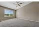 Spacious bedroom with a ceiling fan and a large window at 12711 Colorado Blvd # 714G, Thornton, CO 80241