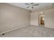 Bedroom featuring neutral walls, ceiling fan, and an ensuite bathroom at 12711 Colorado Blvd # 714G, Thornton, CO 80241