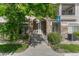 Attractive entryway to condos with stone accents, stairs, and well-maintained landscaping at 12711 Colorado Blvd # 714G, Thornton, CO 80241