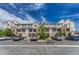 Attractive condominium building with stone accents, balconies, and ample parking on a sunny day at 12711 Colorado Blvd # 714G, Thornton, CO 80241