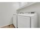 Laundry room featuring full-size washer and dryer with overhead storage shelf at 12711 Colorado Blvd # 714G, Thornton, CO 80241
