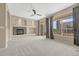 Spacious living room with a fireplace, large windows, and stylish decor at 12711 Colorado Blvd # 714G, Thornton, CO 80241