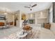Inviting living room featuring a fireplace, cozy seating, and a modern ceiling fan at 12711 Colorado Blvd # 714G, Thornton, CO 80241