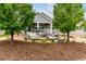 Landscaped backyard featuring stone patio with furniture and view of the home at 7991 Heritage Dr, Thornton, CO 80602