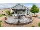 Inviting backyard with a large patio, outdoor seating, and mature landscaping at 7991 Heritage Dr, Thornton, CO 80602