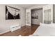 Spacious bedroom with hardwood floors, French doors, and stylish decor at 7991 Heritage Dr, Thornton, CO 80602