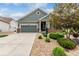 Charming single-Gathering home with a well-maintained lawn, mature landscaping, and an attached two-car garage with driveway at 7991 Heritage Dr, Thornton, CO 80602