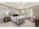 Spacious main bedroom with a large window, neutral tones, and stylish furnishings at 7991 Heritage Dr, Thornton, CO 80602