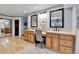 Bright bathroom with double vanity, large mirrors, and vanity space at 1 Red Fox Ln, Littleton, CO 80127