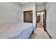 A well-lit bedroom includes a double door closet and neutral carpet flooring at 1 Red Fox Ln, Littleton, CO 80127
