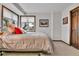 Cozy bedroom with a plush bed, soft natural lighting, and simple decor at 1 Red Fox Ln, Littleton, CO 80127