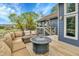 Inviting outdoor deck with comfortable seating and a cozy fire pit, perfect for relaxation at 1 Red Fox Ln, Littleton, CO 80127