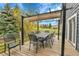Outdoor deck with a large dining table and seating, ideal for al fresco meals and entertaining guests at 1 Red Fox Ln, Littleton, CO 80127