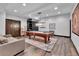 Game room featuring a pool table and a comfortable seating area with decorative rug at 1 Red Fox Ln, Littleton, CO 80127
