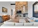 Spacious living room with stone fireplace, hardwood floors, and comfortable seating at 1 Red Fox Ln, Littleton, CO 80127