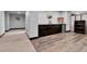 Basement features wood-look floors, a built-in bar, and a popcorn machine at 1 Red Fox Ln, Littleton, CO 80127