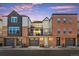 Beautiful townhomes feature brick and modern siding, garages, and private balconies with great curb appeal at 8028 W 52Nd Ln # B, Arvada, CO 80002