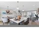 Open floor plan with stylish kitchen island, dining area, and comfortable seating offers a modern living space at 8028 W 52Nd Ln # B, Arvada, CO 80002
