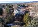 Aerial view of the home featuring the backyard, deck, and landscaping within a serene neighborhood setting at 8369 W Fairview Ave, Littleton, CO 80128