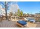 The expansive deck features comfortable outdoor seating, creating an inviting space for relaxation and entertainment at 8369 W Fairview Ave, Littleton, CO 80128