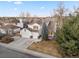 Charming two-story home featuring a three-car garage and well-maintained landscaping with mature trees at 8369 W Fairview Ave, Littleton, CO 80128
