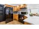 A well-equipped kitchen with stainless steel appliances and bar stool seating at 8369 W Fairview Ave, Littleton, CO 80128