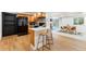 A well-equipped kitchen with stainless steel appliances and bar stool seating at 8369 W Fairview Ave, Littleton, CO 80128