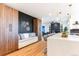 Modern kitchen with a breakfast bar, custom cabinetry, and an open layout at 8369 W Fairview Ave, Littleton, CO 80128