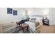 Inviting main bedroom featuring a plush bed, stylish decor, and a view to the bathroom at 8369 W Fairview Ave, Littleton, CO 80128