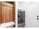 Charming mud room with built-in bench and coat hooks, and a convenient pet shower at 8369 W Fairview Ave, Littleton, CO 80128