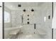 A modern glass shower with dual shower heads and built in marble seating at 8369 W Fairview Ave, Littleton, CO 80128