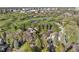 Desirable neighborhood aerial view with mature trees, green spaces, and city views in the distance at 1991 E Alameda Ave # 14, Denver, CO 80209